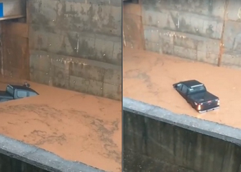 Motorista de caminhonete fica ilhado ao tentar passar por trincheira alagada em Cuiabá; vídeo